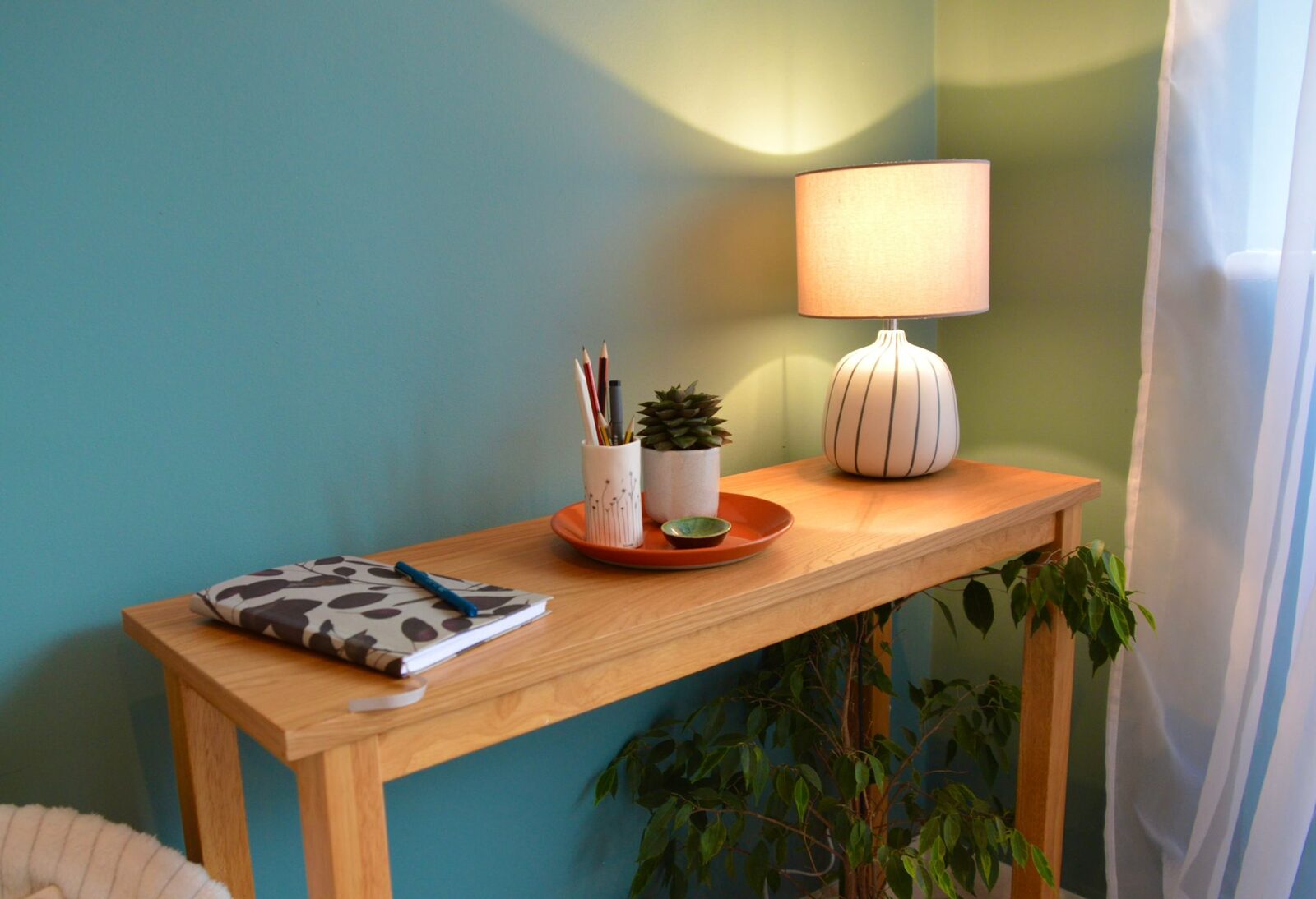A warm corner of the practice, with a sideboard and lamps